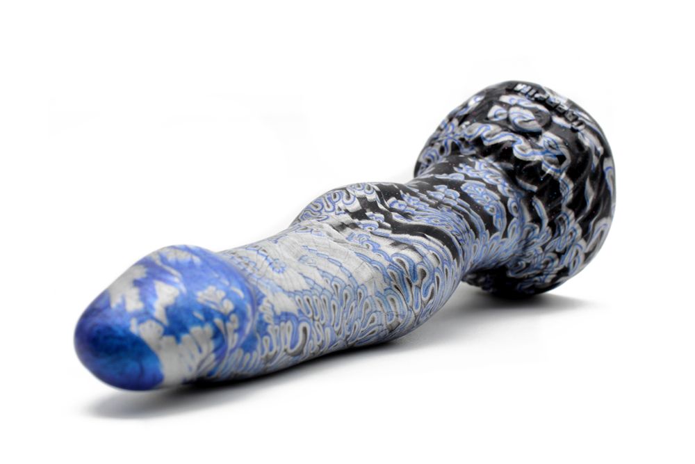 The Lunaris werewolf dildo pictured from a slightly above angle, showing off the 'flatter' profile of the knot.