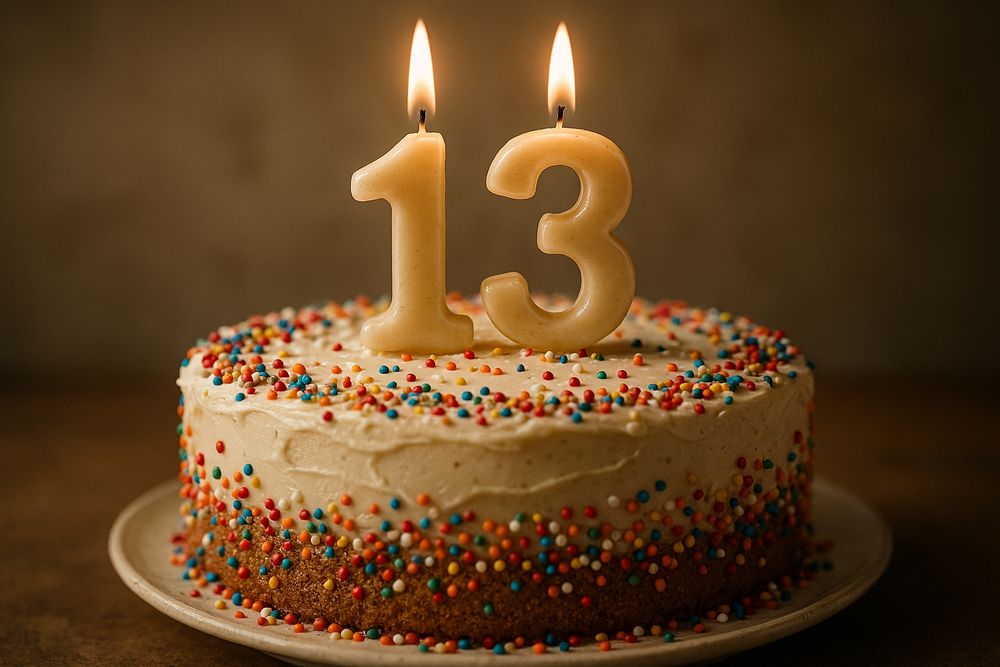 birthday cake with candles shaped like the number 13