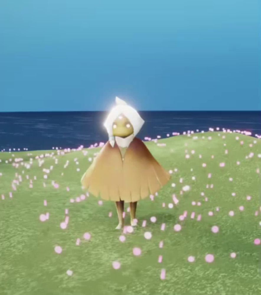 a person with wings is standing on a grassy field