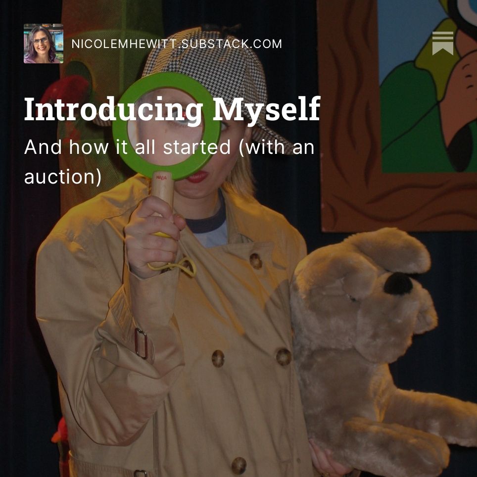 An image of (a much younger) Nicole in a detective costume with a magnifying class held up to her eye. She is holding a stuffed puppy.