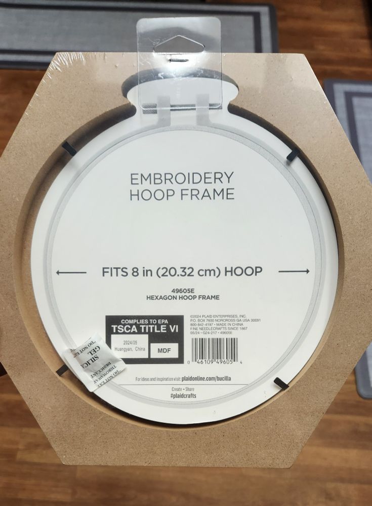 A frame made specifically to fit an eight inch embroidery hoop, a circle opening and a hexagonal outer shape