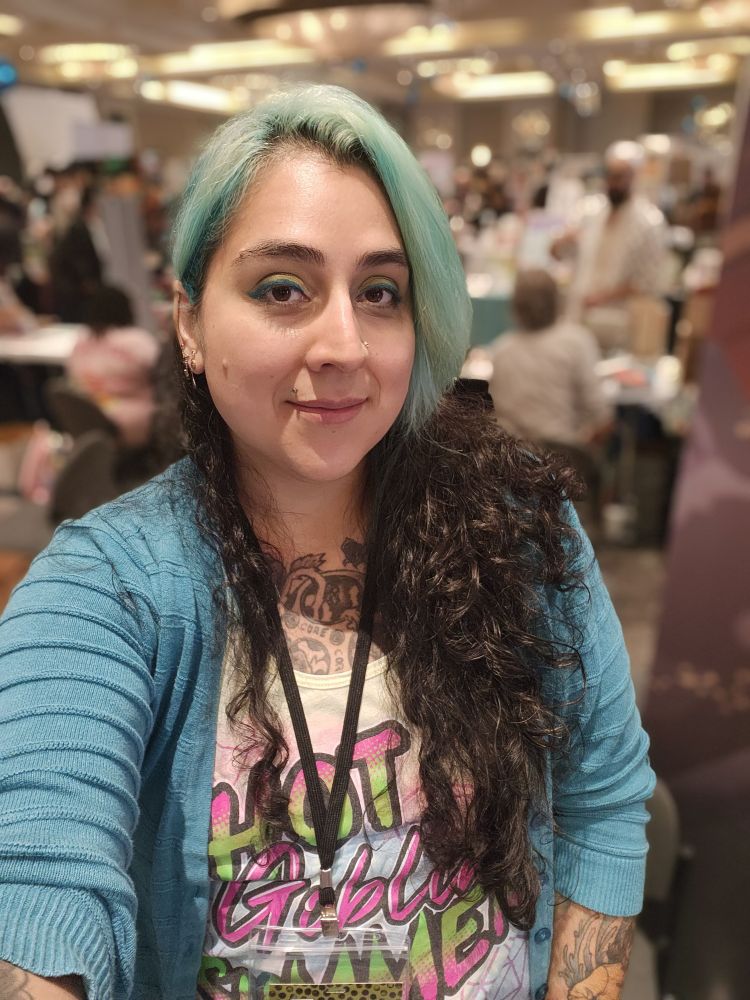 Portrait of the artist behind the table 