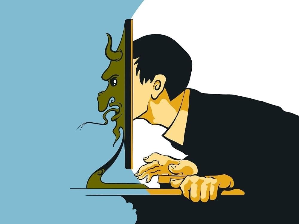 Image of a man pushing his face through a computer monitor with a demon face coming out the other side. 