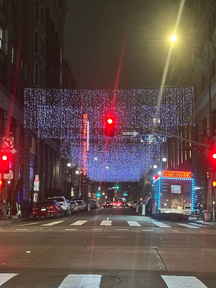 Street scene in downtown Los Angeles food truck vintage hotel and holiday street decorations 