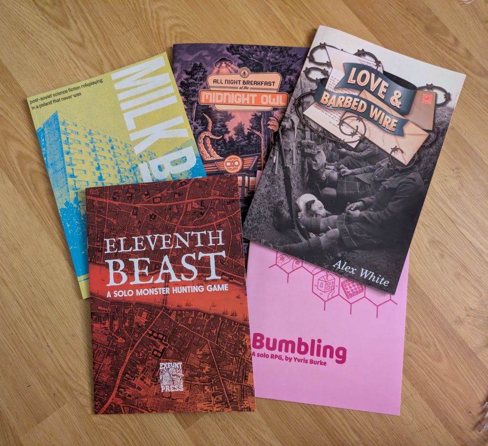 A selection of A5-size RPG zines and books