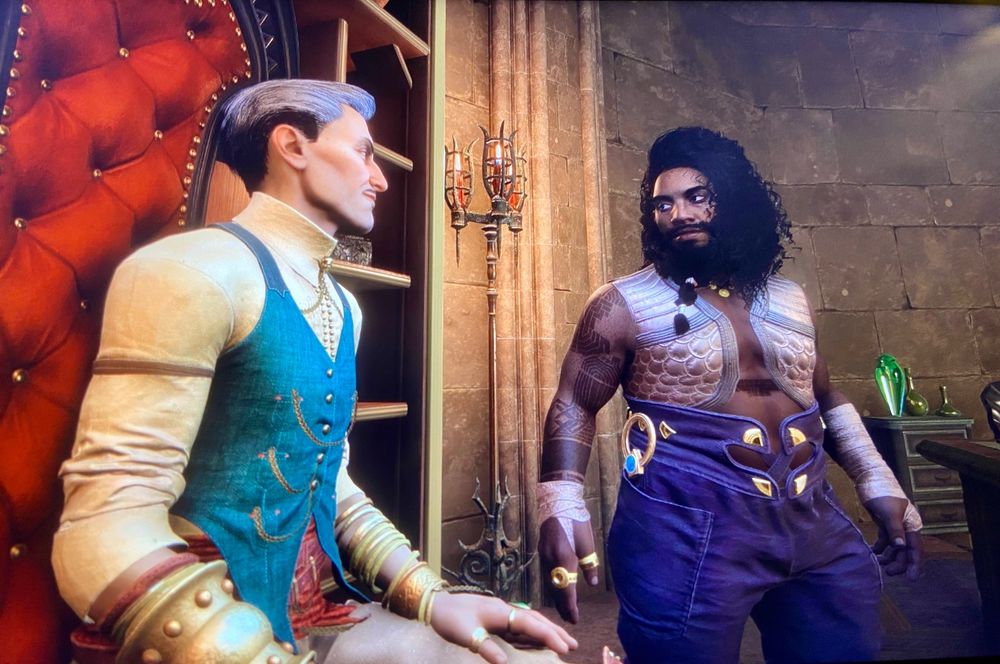 Rook: a brown-skinned, freckled dwarf with curly, shoulder-length black hair and a thick black beard, wearing a pale vest and high purple pants. His arms and chest are covered in geometric tattoos. Rook is making eyes at Emmrich, a dapper older white man. Emmrich is seated in a high-backed red chair, making him and Rook (standing) approximately the same height.  