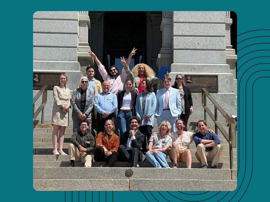 Group photo of Rocky Mountain Equality staff in front of the Denver capitol building
