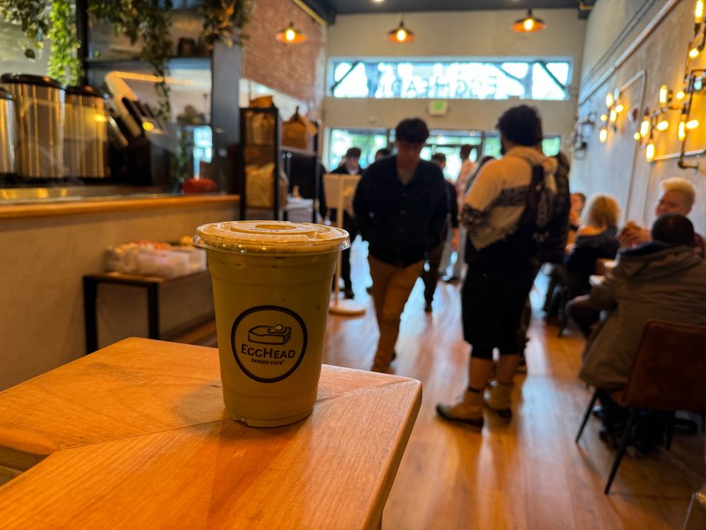 Egghead iced matcha latte coffee in crowded EggHead