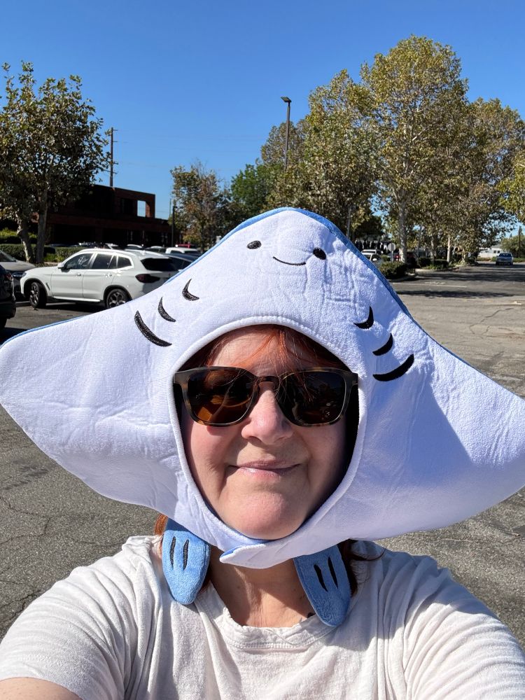 Woman wearing sunglasses and a stingray costume