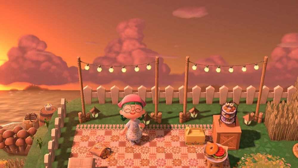 lohla’s animal crossing character standing in a picnic area with the sunset sky behind them full of puffy clouds