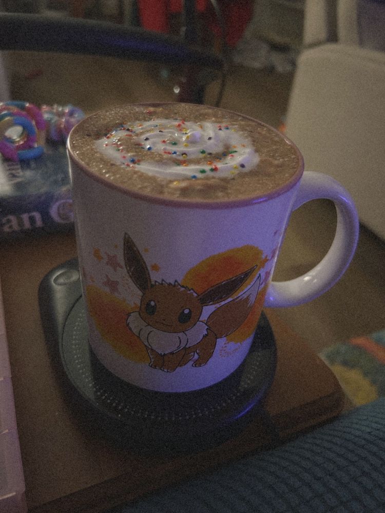 a mug of hot cocoa in an eevee mug