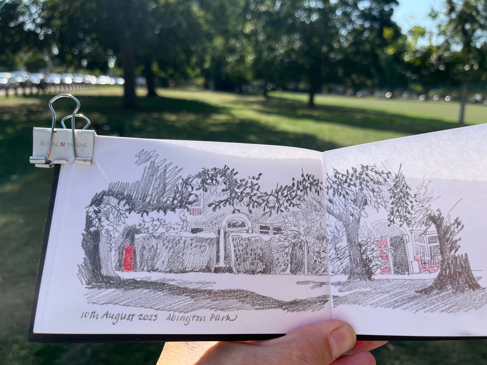 A pencil sketch looking through trees towards houses