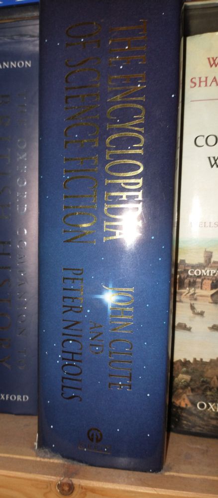 The Encyclopedia of Science Fiction (hardback) on bookshelf 