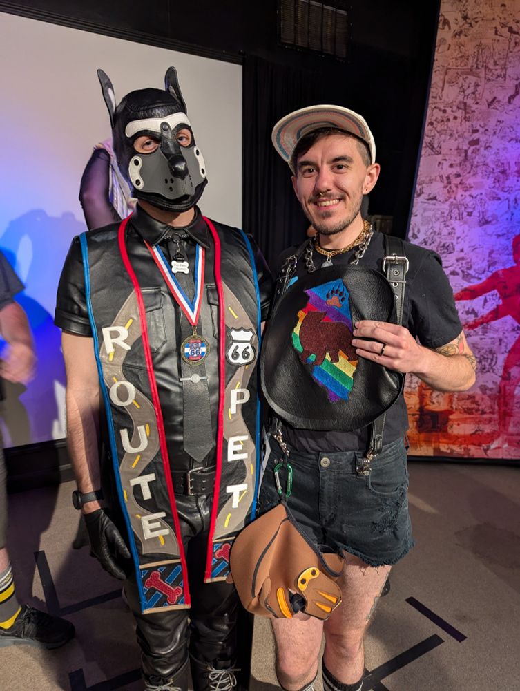 Delta standing with the newly awarded Pup Arlo, Illinois Pet 2025