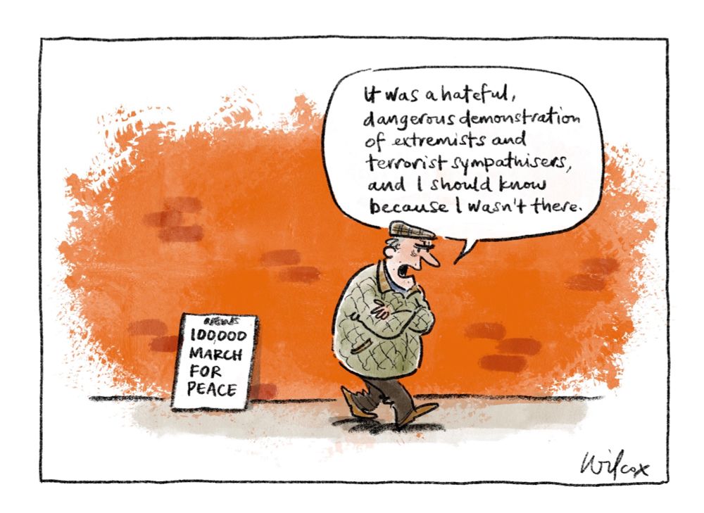 Single frame. News placard: “100000 MARCH FOR PEACE”. Grumpy man walking past in flat cap and puffy jacket, arms crossed, says, “It was a hateful, dangerous demonstration of extremists and terrorist sympathisers and I should know because I wasn’t there.”