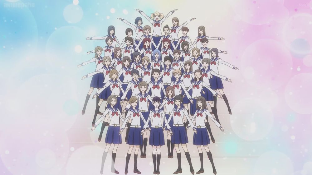 Screenshot of Kageki Shoujo.
Kouka School's 100th generation class has a group photo on a bubbly pastel background.