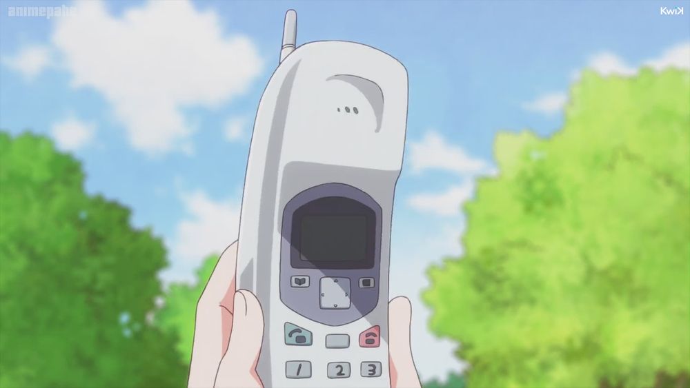 Screenshot of Wakaba Girl.
A white cordless telepone is held up to the sky.