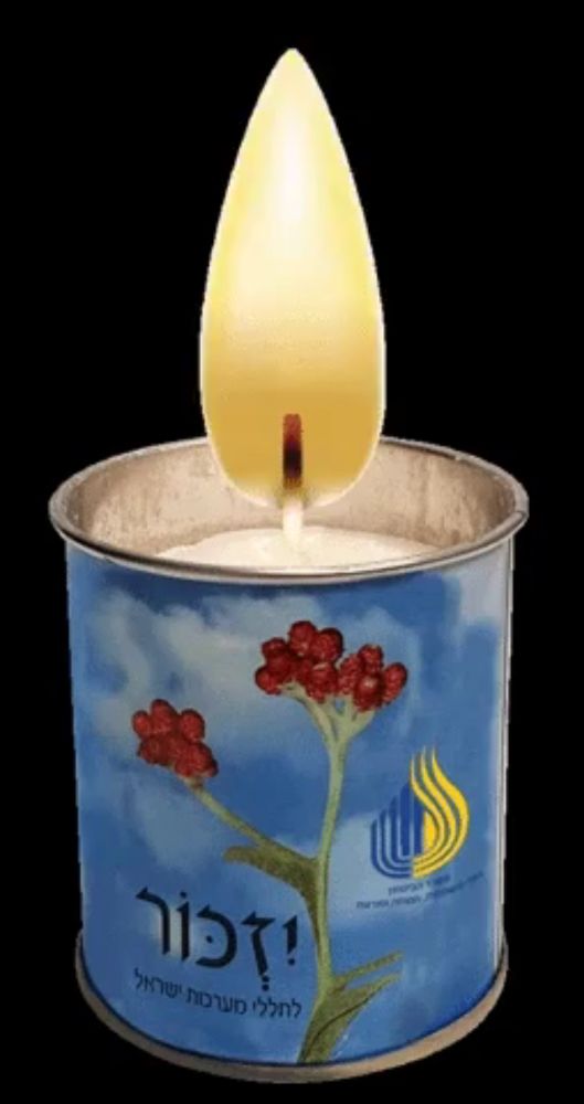 a candle in a blue tin with a flower on it