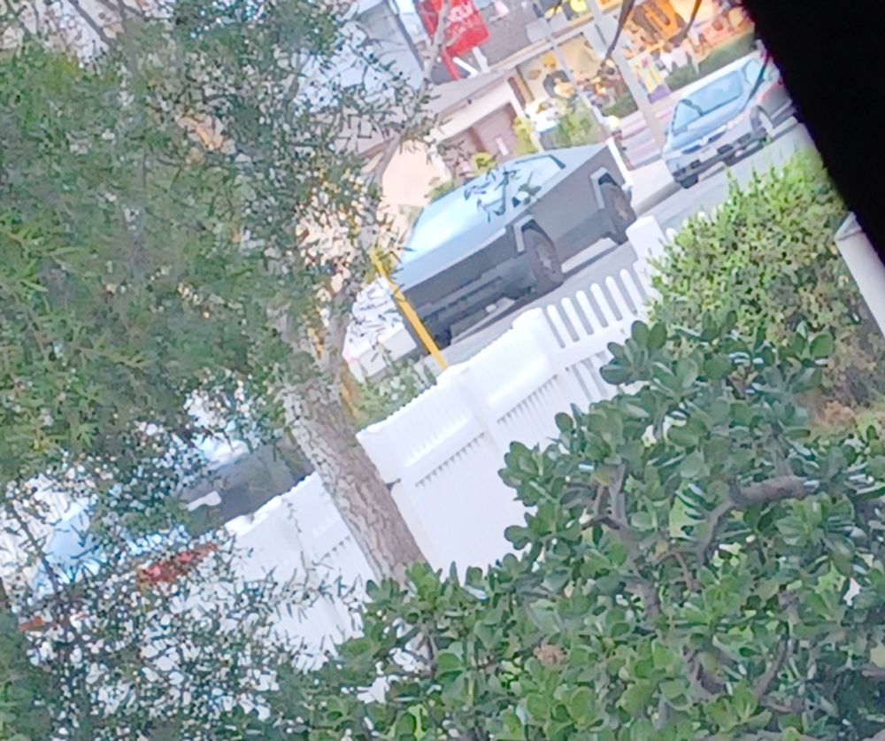 Photo of a cybertruck.cybertrucks are owned/invented by tesla. 
They are also called swasticars since Elons nazi salute back in jan20. 