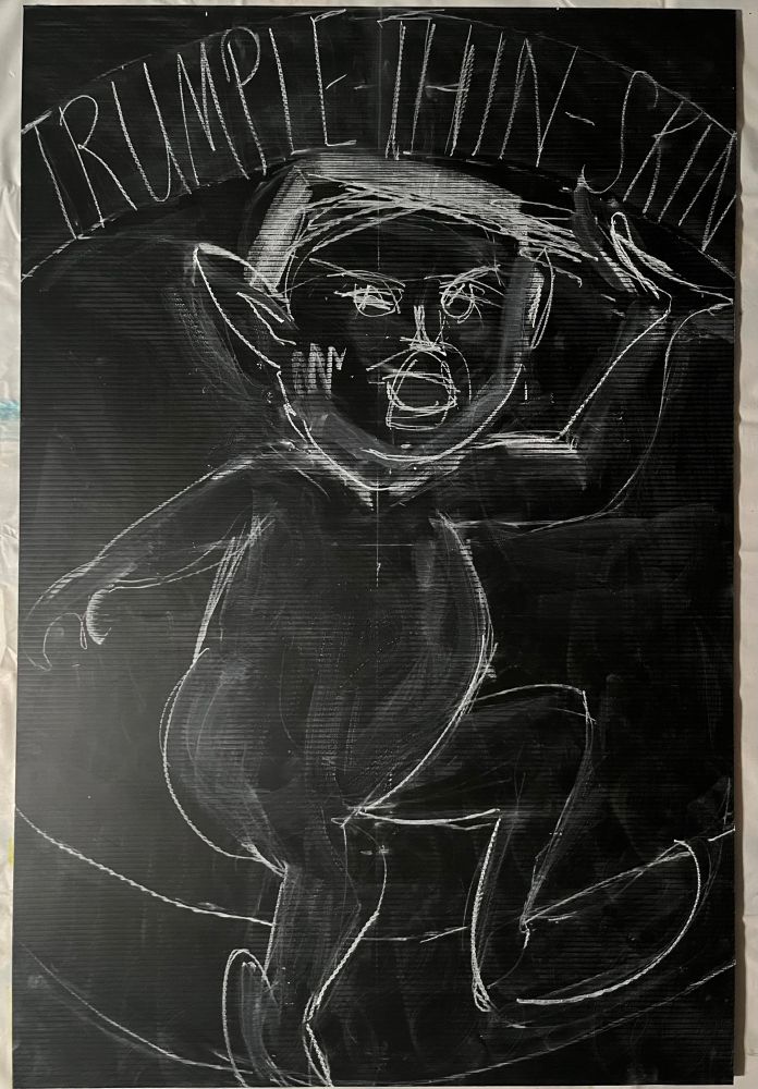 A sketch of a mad elf on a black poster board with the words at the top: Trump-Thin-Skin.