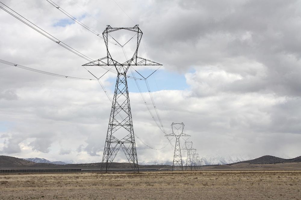 The southern edge of the new Faraday Solar Project runs along these high-voltage transmission lines. This photo looks ESE from the project's southwest corner. Behind the camera a new substation is under construction.