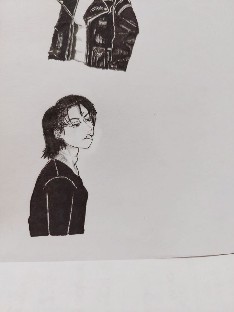 Little sketch of Corky from the movie: "Bound" in black and white. She is slightly in profile with a lowered gaze. 