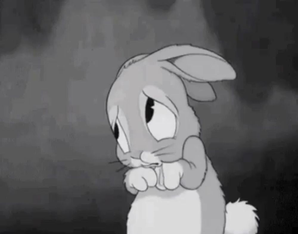 a black and white cartoon of a sad bunny