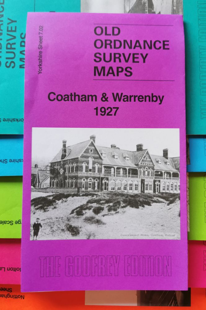 Our Coatham & Warrenby 1927 map, a happy and bright purple colour, sat on a group of other bright maps.