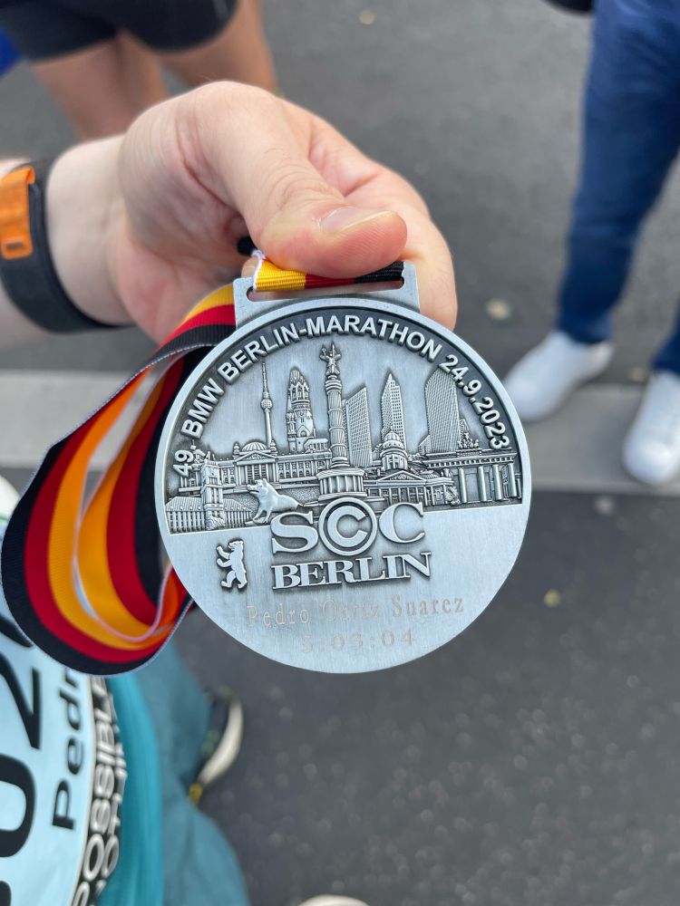Pedro’s medal for finishing the Berlin Marathon, time reads 5:03:04