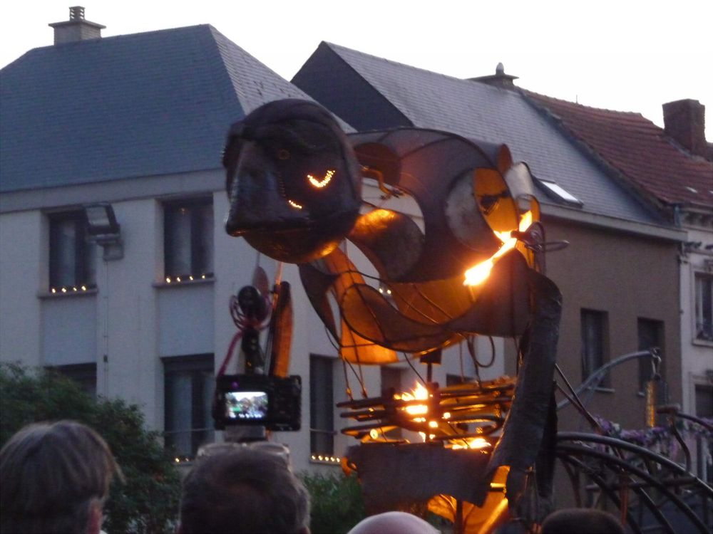 A metal puppeteered giant that has been lit on fire.