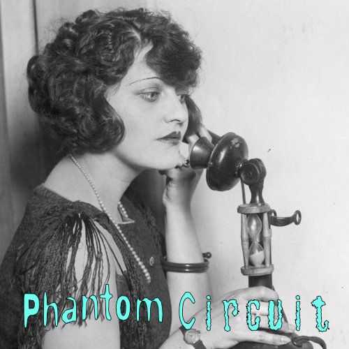 A lady waiting on the telephone.
