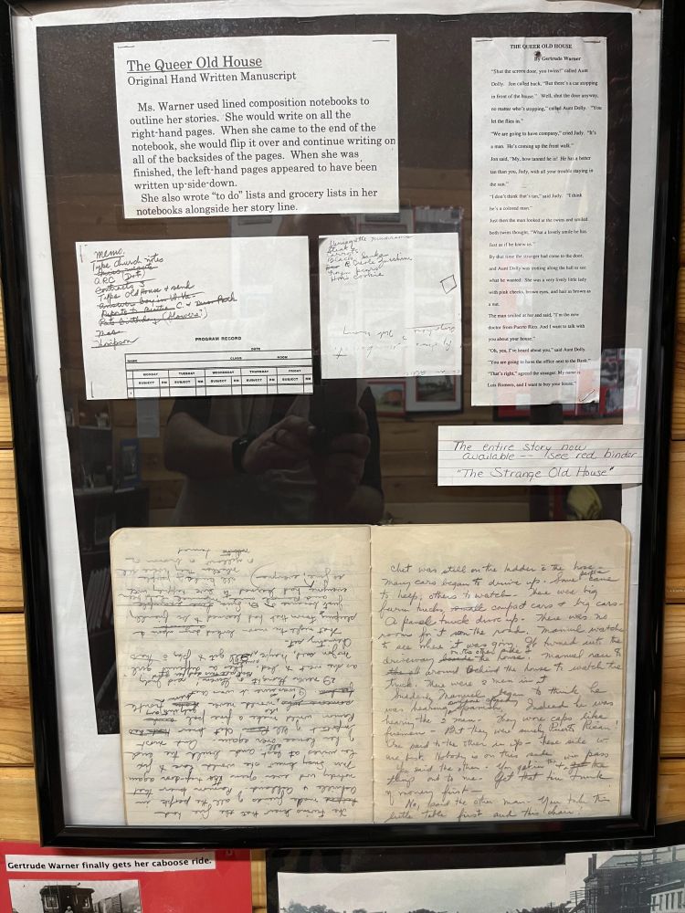 A sample of her handwriting and manuscript. A composition book with upside down script on the left and upright script on the right.