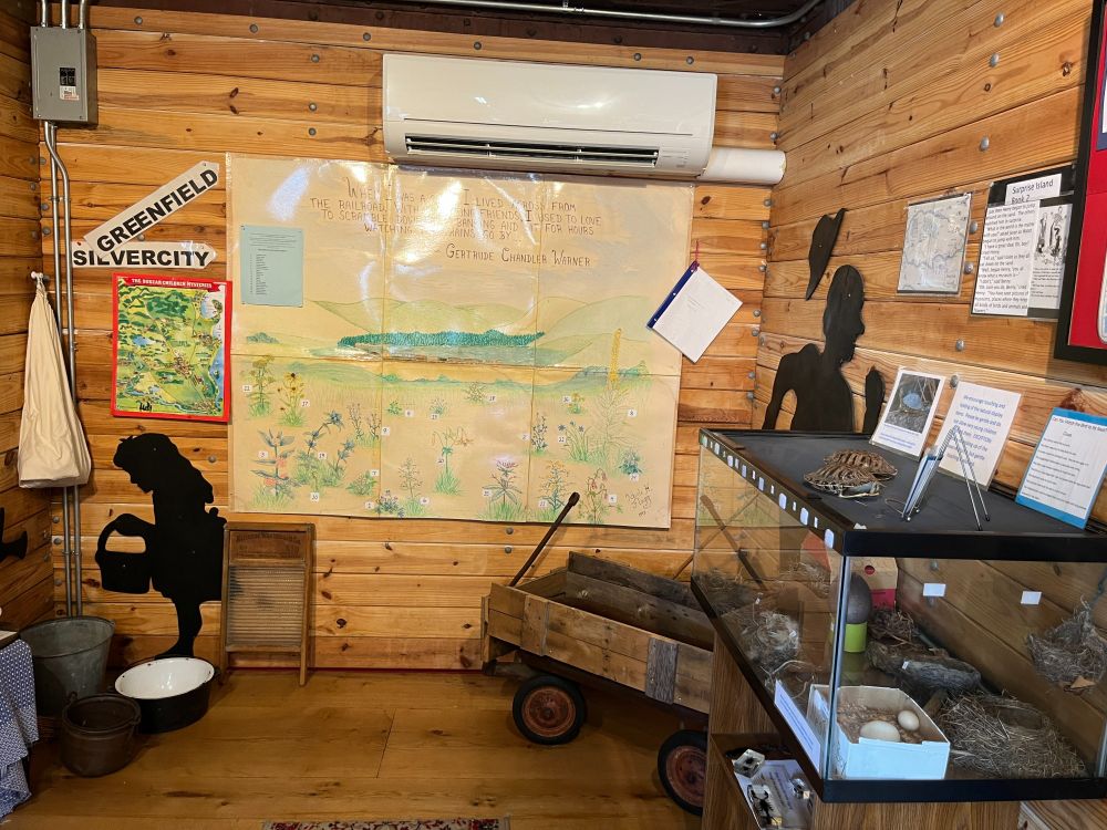 Maps and cut outs of her school room and how she taught students.