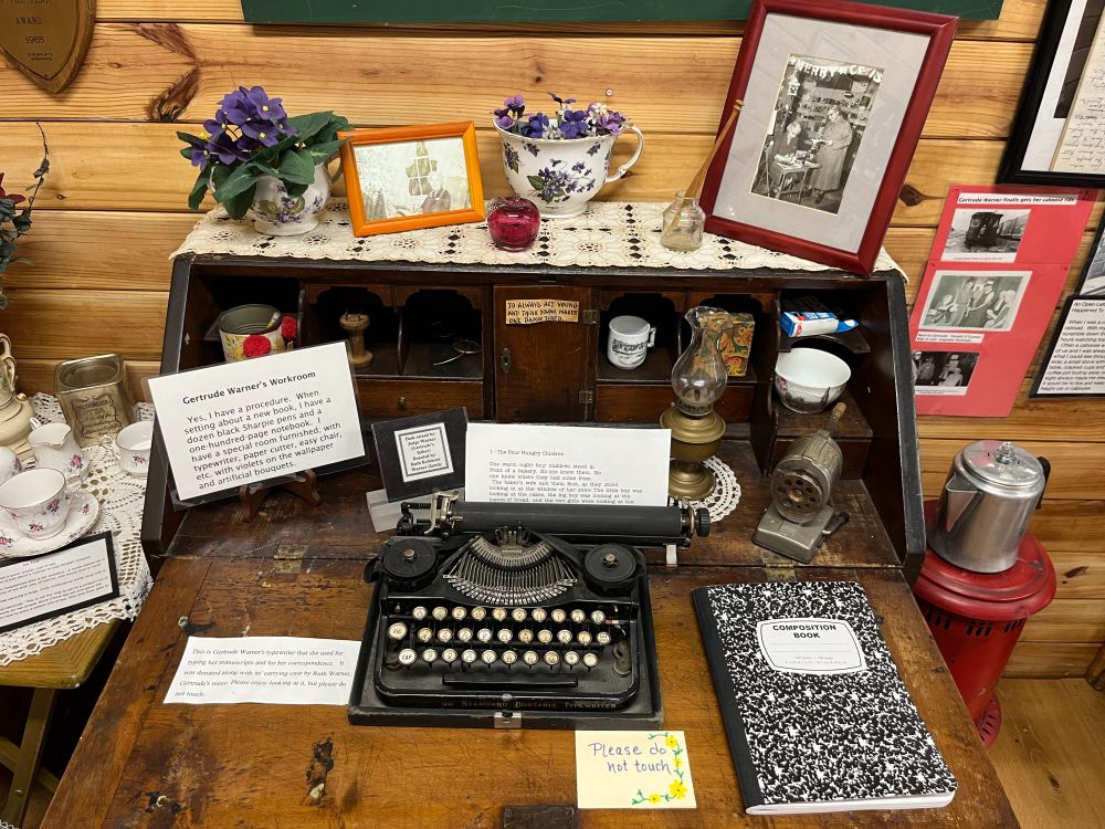 Gertrude's actual desk, with composition book and typewriter, and pencil sharpener. 
