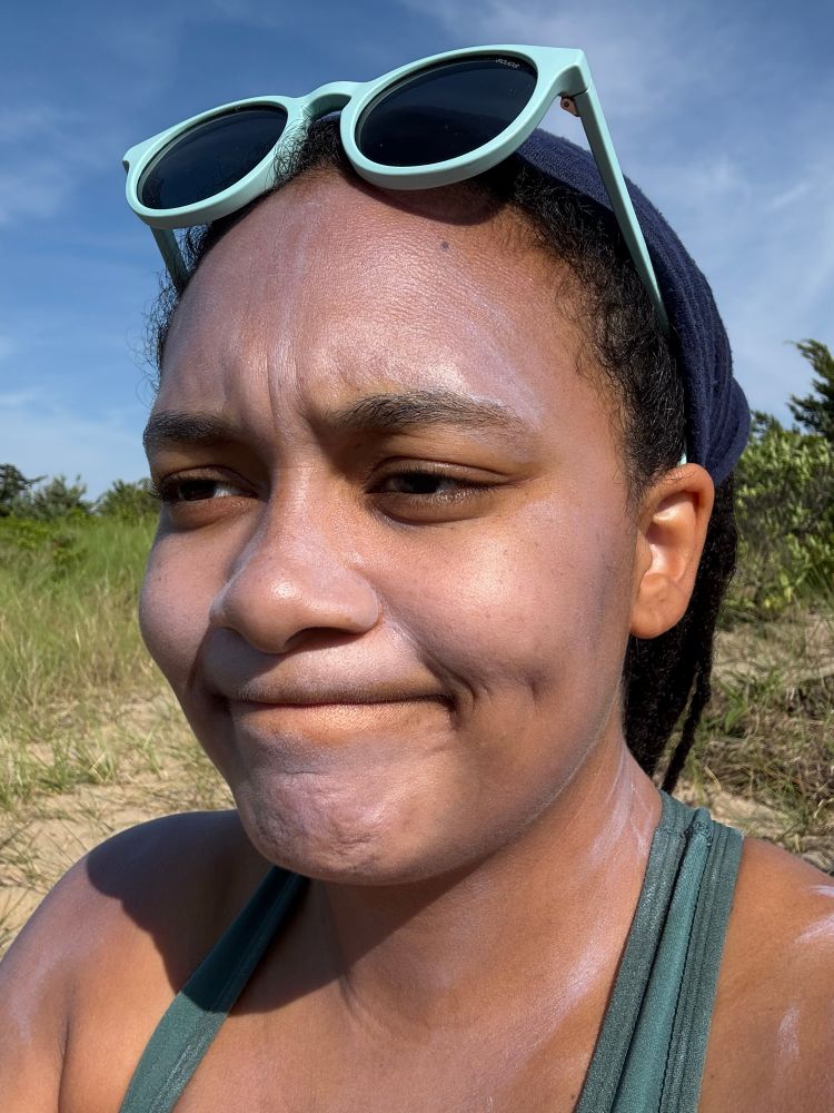 Jaida wearing mineral sunscreen with a terrible white cast that makes her look like a literal ghost