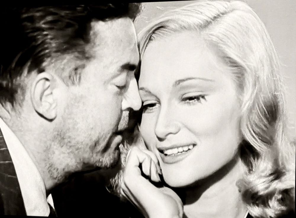 A man and woman canoodling.