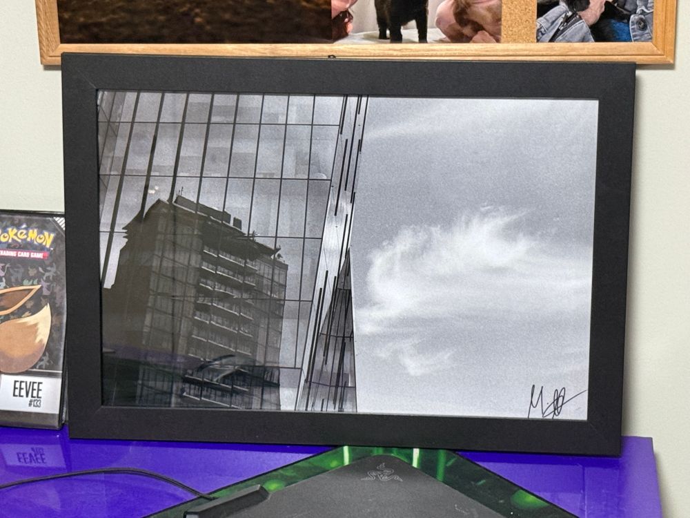 A photo showcasing Mark's photograph entitled "Glass Giants" framed and on display in the house of a customer of his print shop