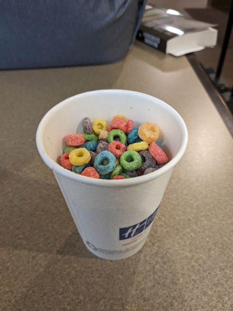 Paper cup full of Fruit Loops