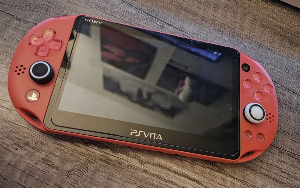 An orange PS Vita 