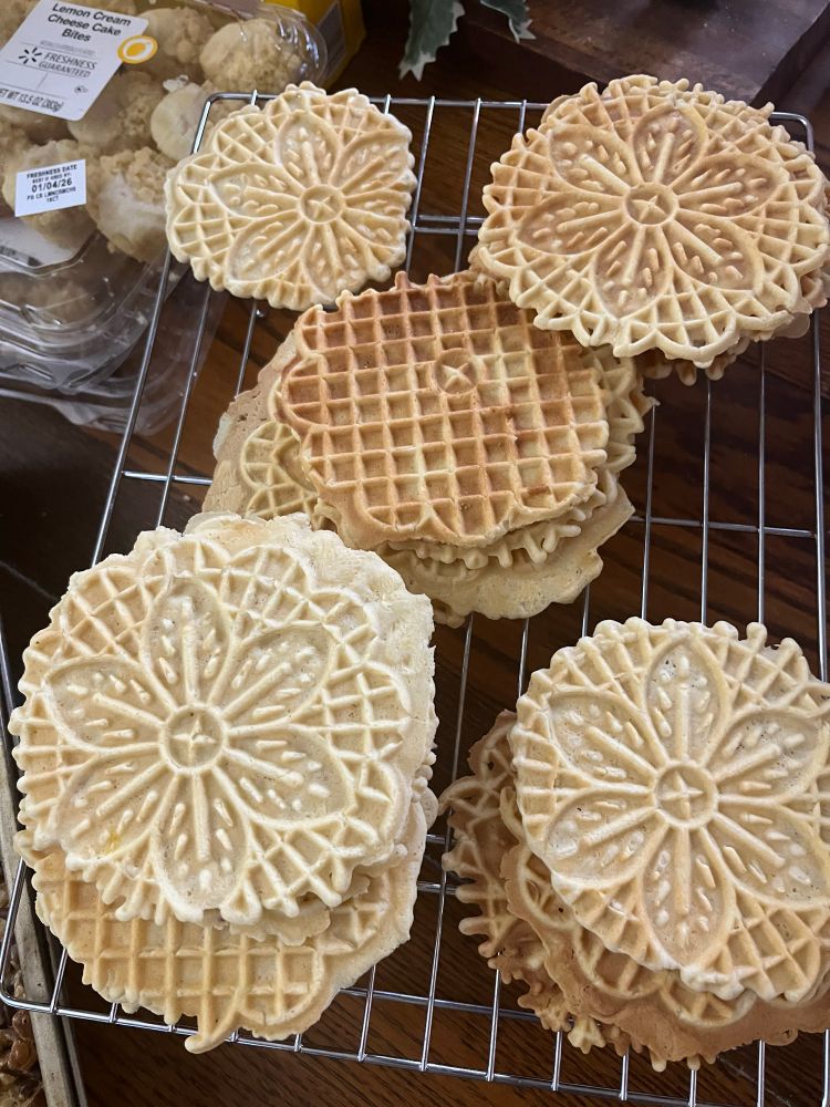 An assortment of pizzelles, very thin waffly cookies