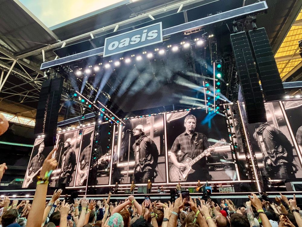 Photographs from an concert by British rock band Oasis at Wembley Stadium in London.