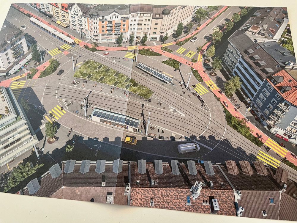 Photographs of the pages of a colourful information booklet about Zurich’s “E-Bike City” project, which proposes reallocating half of its street space to pedestrians, cyclists, and public transport. 