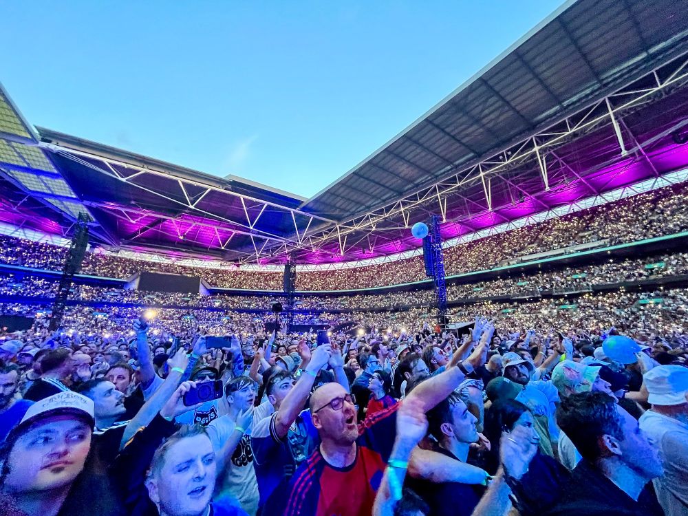 Photographs from an concert by British rock band Oasis at Wembley Stadium in London.