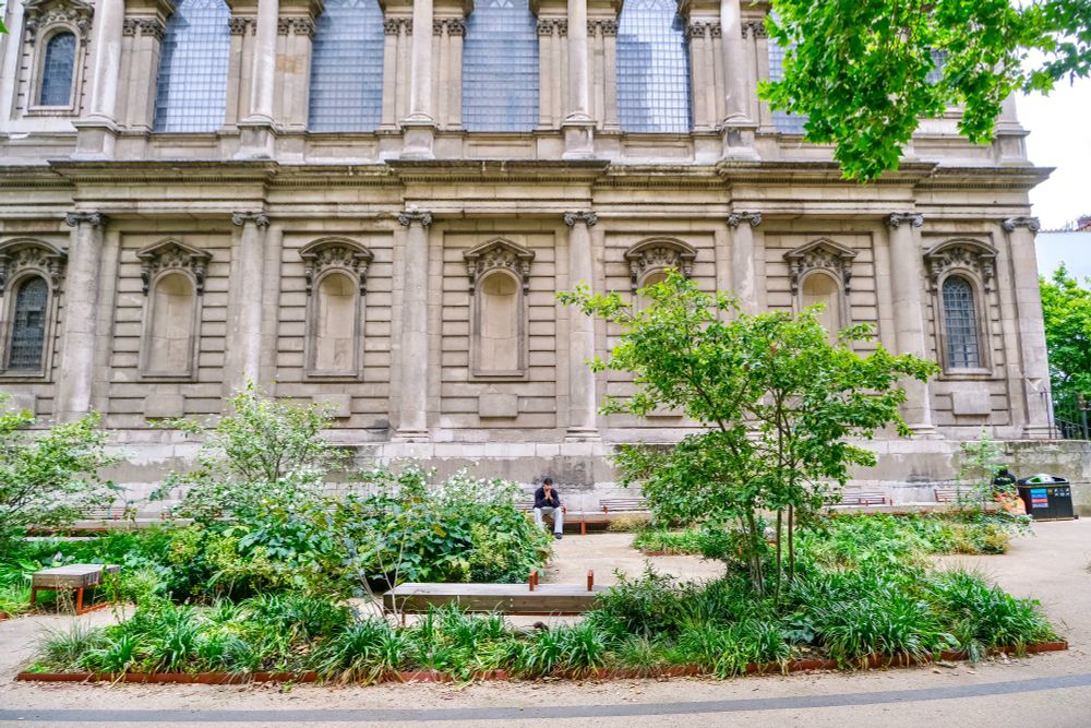People of all ages and abilities walk, cycle, sit, and socialise on the Strand Aldwych—a former arterial turned pedestrian zone in London, which is lined with buildings, trees, flowers and plantings, benches, and terraces.