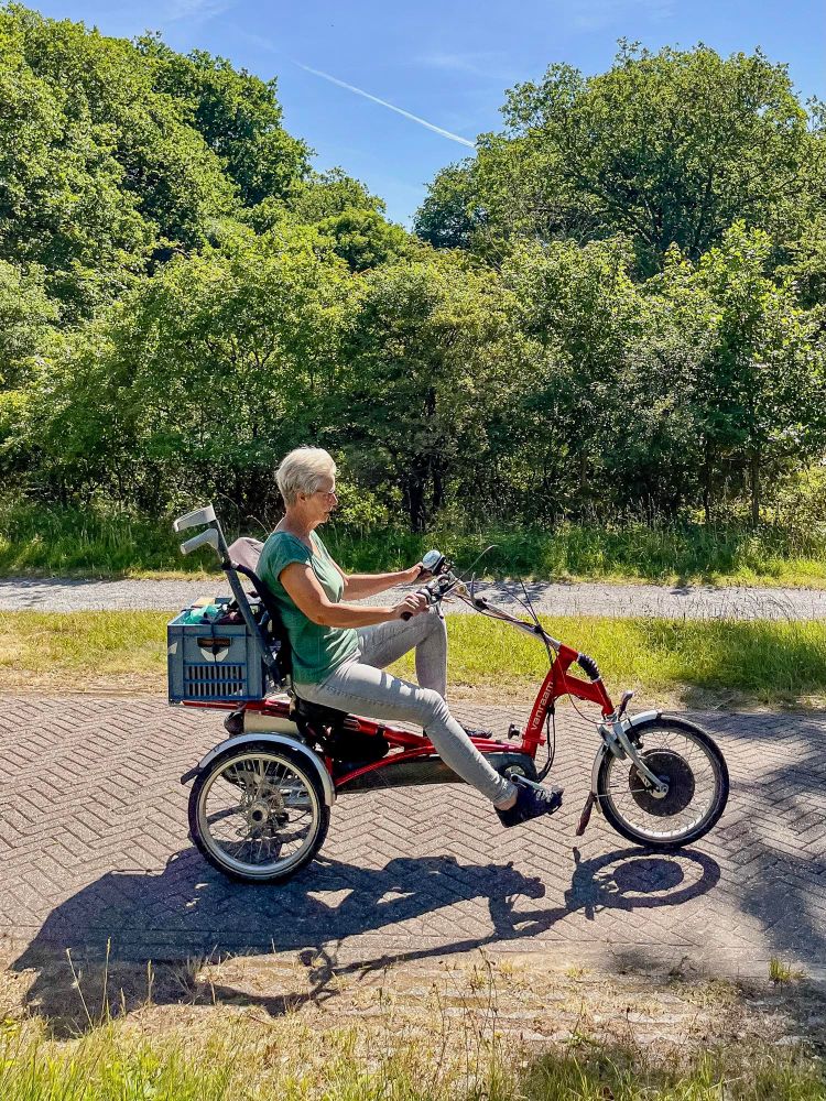 People of all ages and abilities ride tricycles for transportation on the streets of the Netherlands.