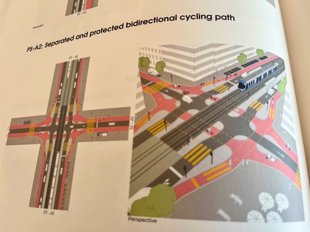 Photographs of the pages of a colourful information booklet about Zurich’s “E-Bike City” project, which proposes reallocating half of its street space to pedestrians, cyclists, and public transport. 