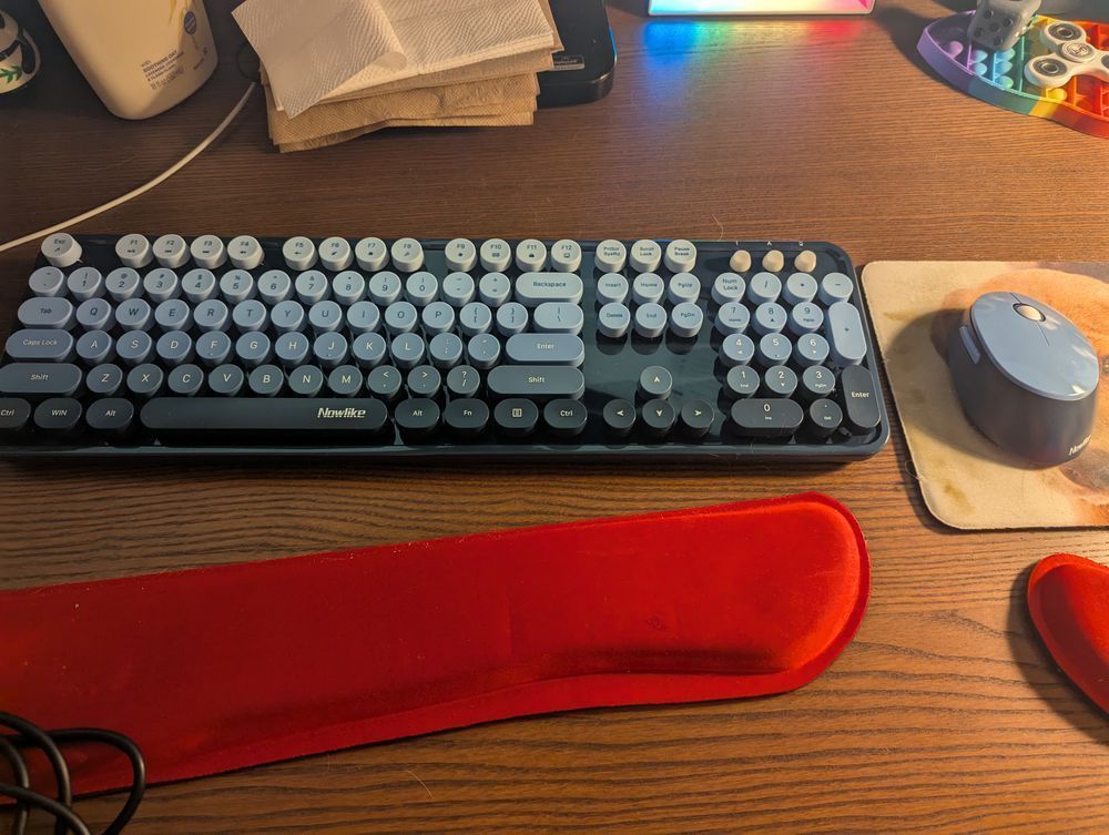 a light to dark blue gradient keyboard with a matching mouse