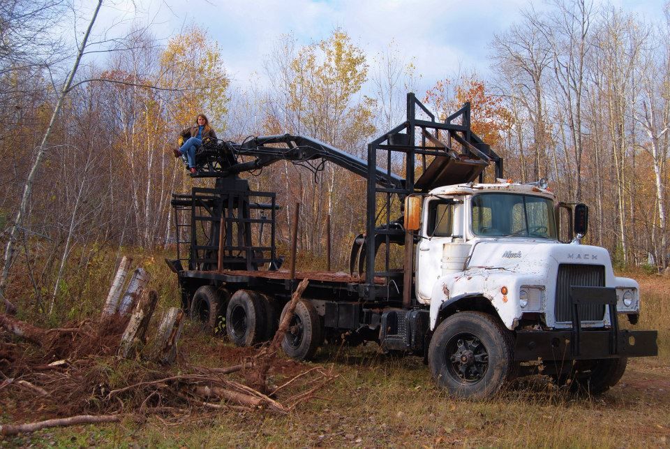 Sitting in the operator's seat for the knuckle boom on a vintage logging truck.