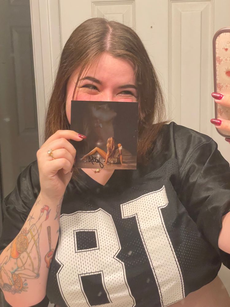 Wearing my Tate jersey from last era with the signed photograph from this era. The photo is covering most of my face but I’m smiling so hard