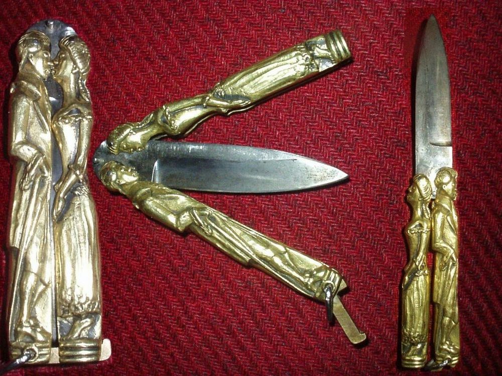 butterfly knife. sheathed it’s a couple kissing. unsheathed, they stand back to back